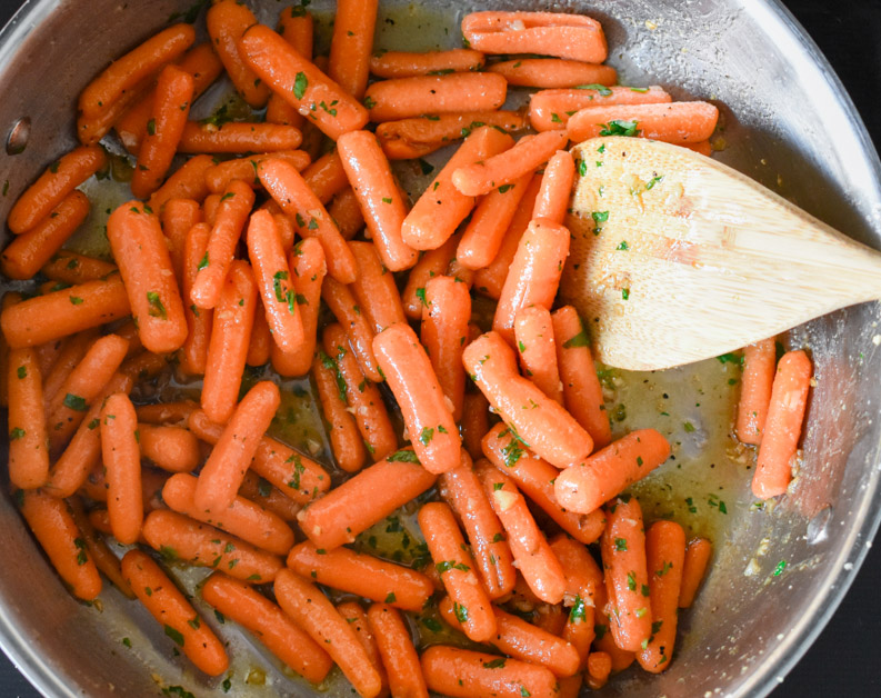 honey glazed carrots in pan with brown butter