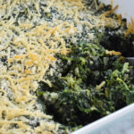 Creamed spinach with scoop