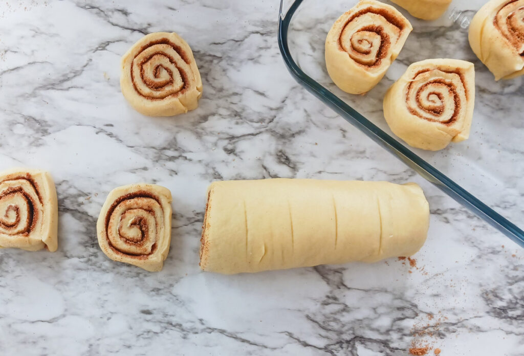 rolled up and equally sectioned cinnamon roll yeast bread rolls