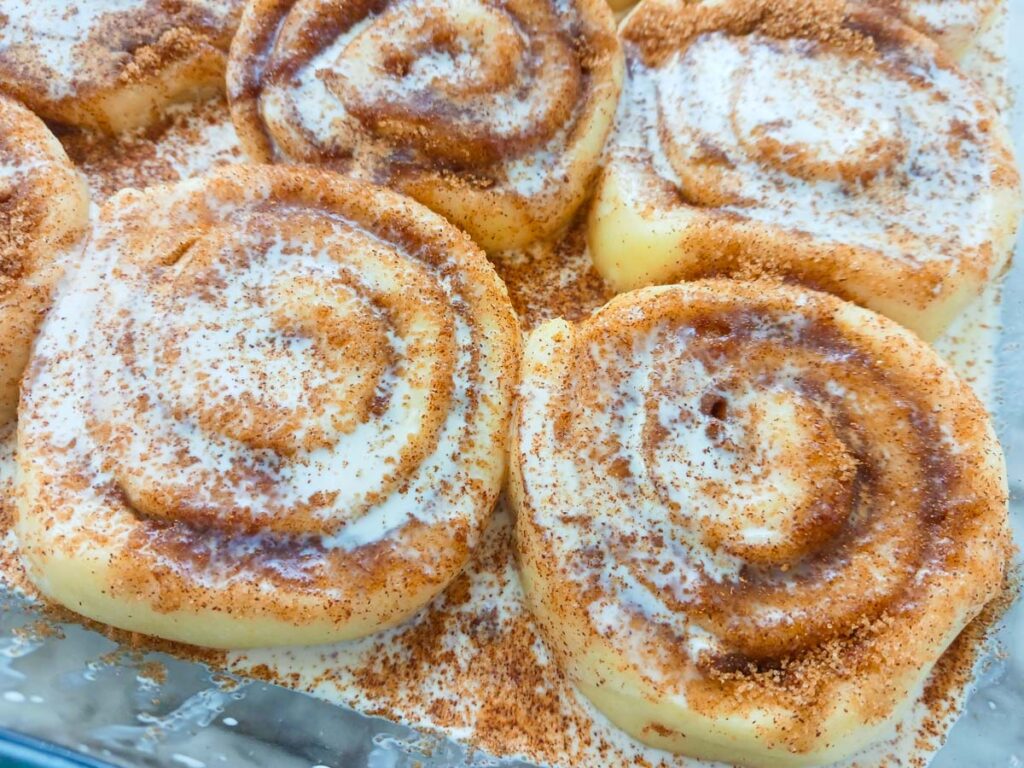 Cinnamon rolls in warm cream bath